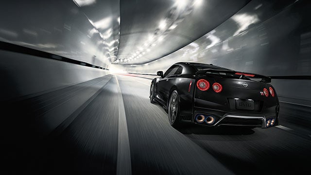 2023 Nissan GT-R seen from behind driving through a tunnel | Lupient Nissan in Brooklyn Park MN
