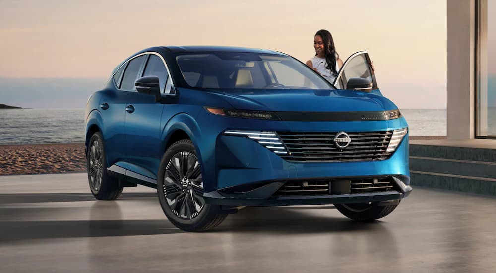 Blue 2025 Nissan Murano Platinum parked at a Nissan dealer near Eagan.