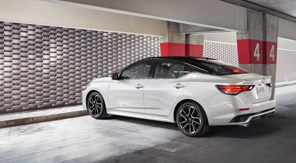 White 2025 Nissan Sentra SR parked in a parking garage.