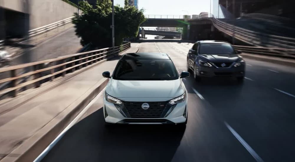 Two 2025 Nissan Sentra SRs driving in a city.