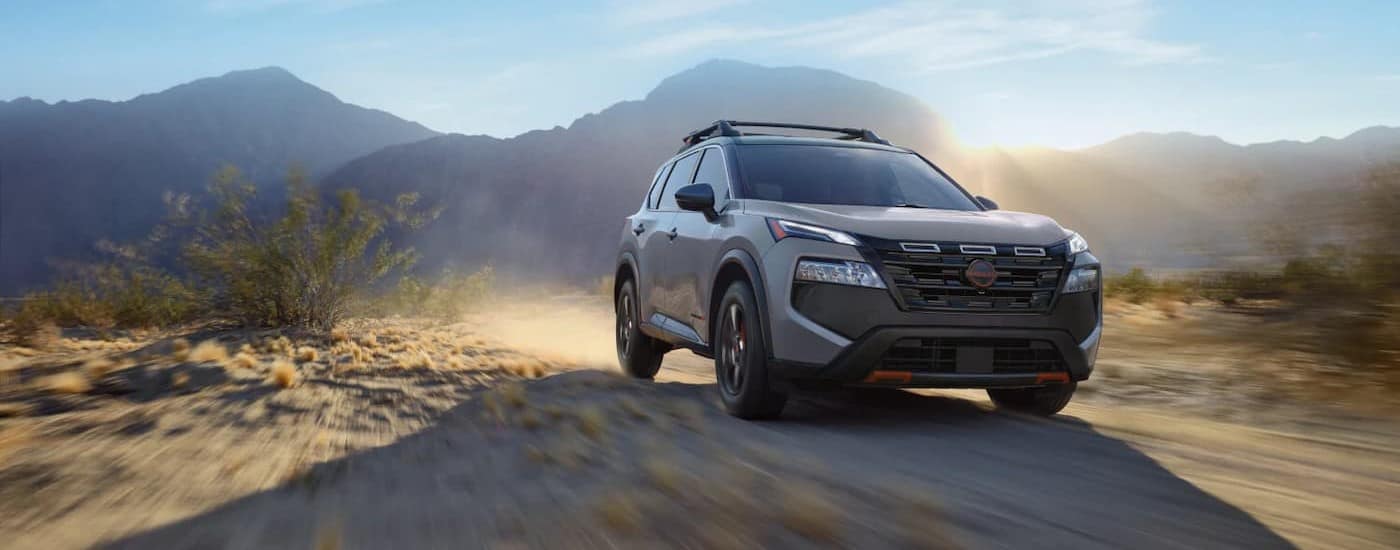 A gray 2025 Nissan Rogue Rock Creek off-roading.