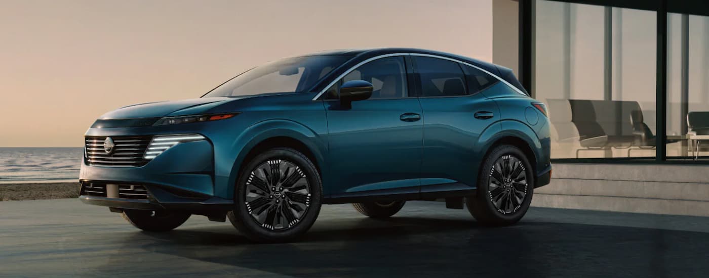 A blue 2025 Nissan Murano parked for sale